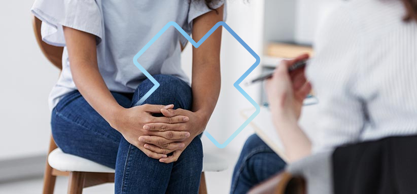 Personne assise en consultation, illustrant une intervention en ergothérapie en santé mentale.